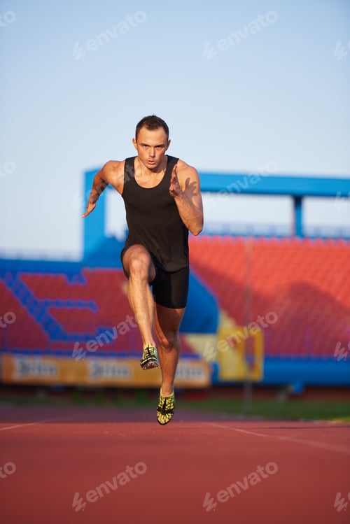 Preview: Sprinter Leaving Starting Blocks On The Running Track. Explosive Start.