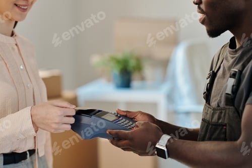 Preview: Woman paying for service with card