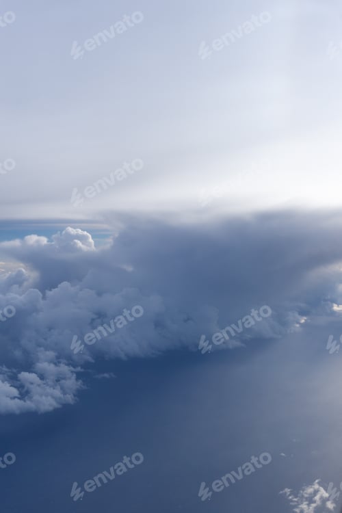 Preview: Aerial view of clouds in the sky. View from airplane window