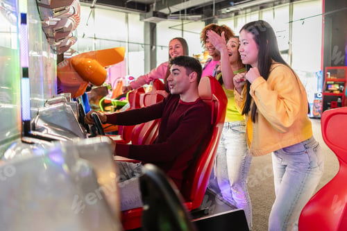 Preview: Friends Cheering While Playing Arcade Racing Game