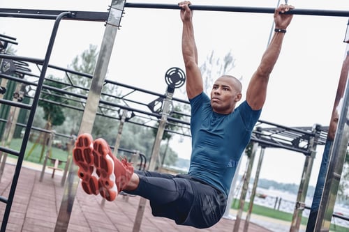 Preview: Young male jogger athlete training and doing workout outdoors in