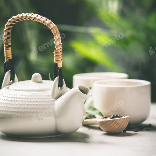 Preview: Tea composition on tropical leaves background, close up