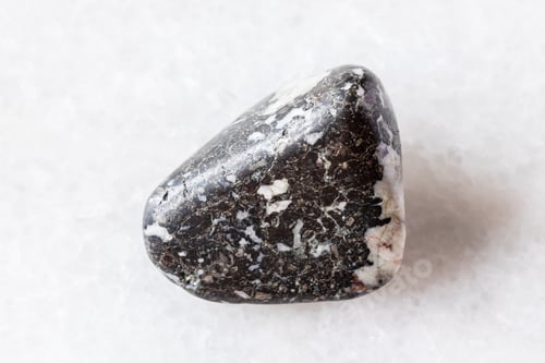 Preview: sample of tumbled trachybasalt rock on white