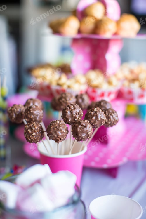 Preview: Chocolate cakepops on holiday dessert table at kid birthday party