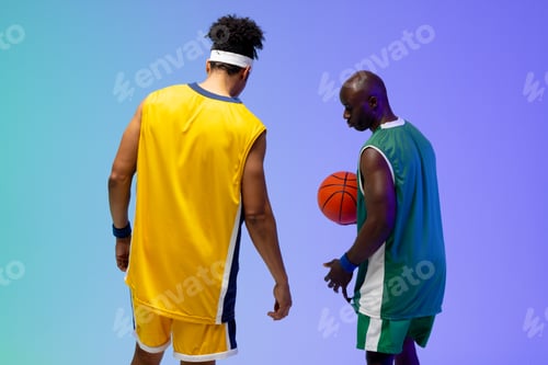 Preview: Image of two diverse basketball players with basketball on purple to green background