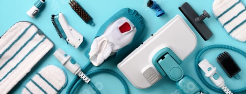 Preview: Set with modern professional steam cleaners on blue background. Top view, flat lay. Banner with copy