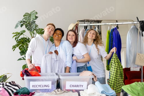 Preview: young people are engaged in charity and volunteering, selecting clothes for recycling and charity