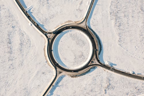 Preview: Traffic circle road, sunny winter, aerial top view