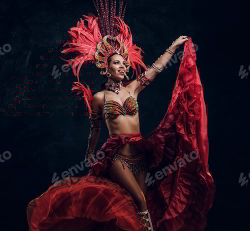 Preview: Beautiful brazil dancer in red feather costume is dancing on small scene