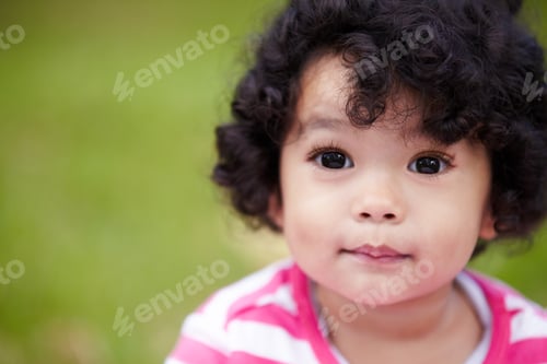 Preview: Bright-eyed and filled with potential. Closeup of a beautiful little girl looking away.
