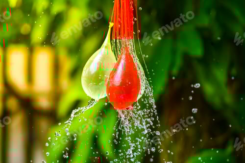 Preview: Colorful water balloons playing with small plastic pool on summer holiday.
