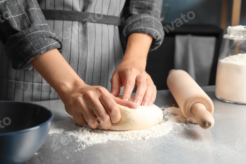 Preview: Woman kneading dough for pastry on table