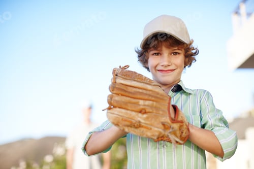 Preview: Cropped portrait of a young boy playing baseball in the yard with his father in the background