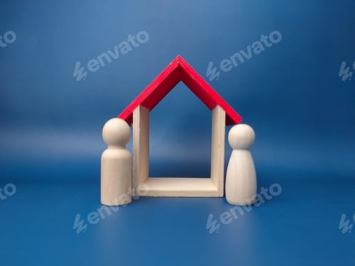 Preview: A couple wooden doll with wooden house on a blue background.