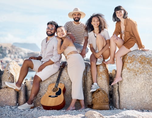 Preview: Shot of a group of friends enjoying their time together at the beach