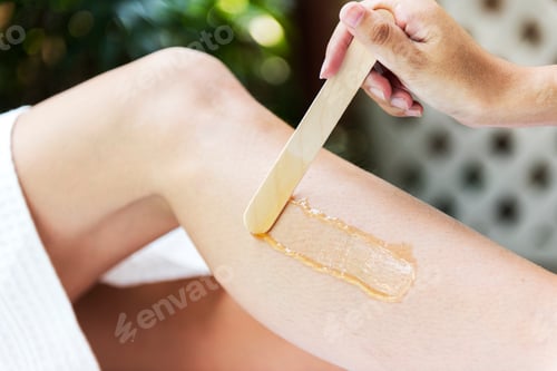 Preview: Woman getting legs waxed at a spa