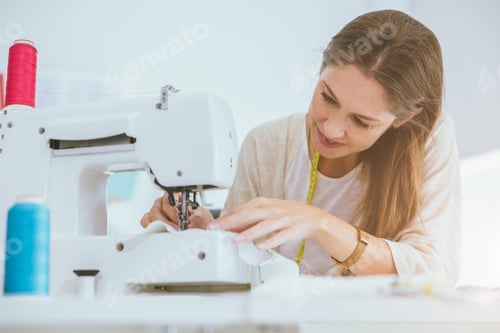 Preview: costume professional woman work enjoy with digital sewing machine happy in tailor studio