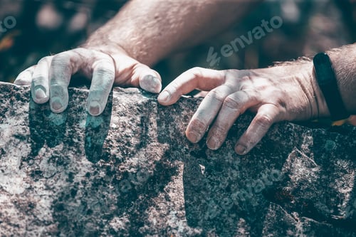 Preview: Male hands with chalk powder in cliff climbing sport