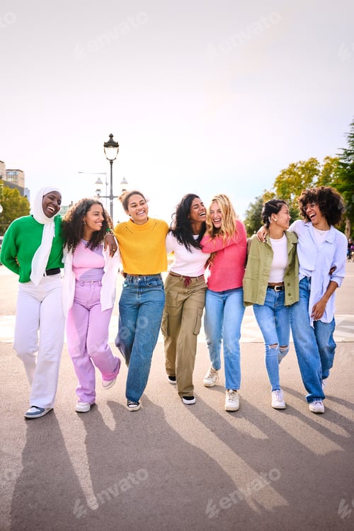 Preview: Group young diverse friends walking relaxed and talking to each other and sharing fun leisure time.