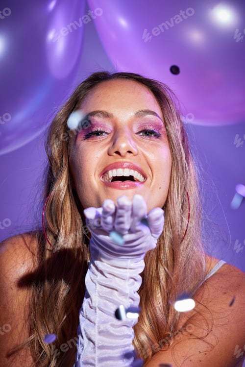 Preview: Beauty, confetti and portrait of a happy woman in a studio with balloons for a birthday celebration