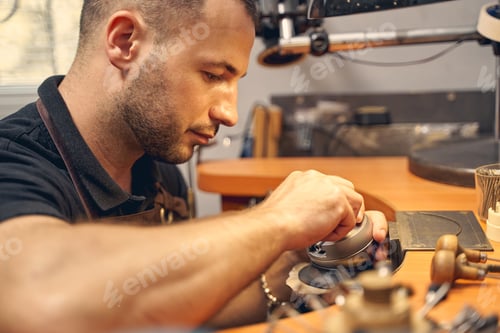 Preview: Focused young man working in a studio
