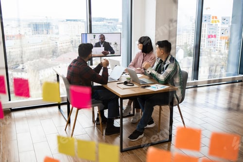 Preview: Team meeting with remote colleague via video conference