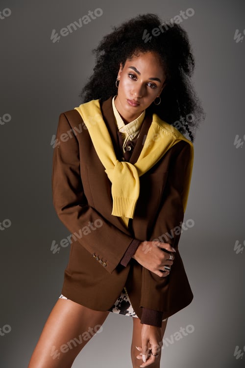 Preview: Chic autumn fashion inspiration featuring a stunning woman in stylish studio setting