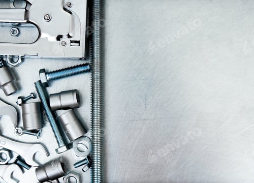 Preview: Metal frame and many working tools on the scratched metal background.