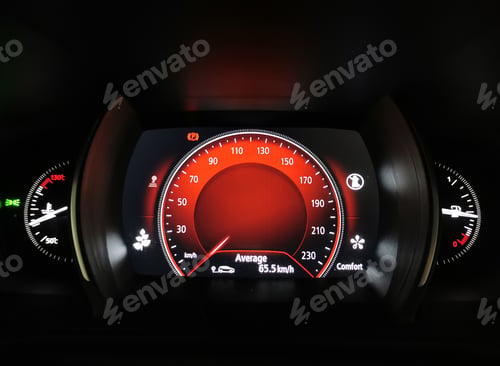 Preview: Close-up of Modern car interior with digital gauges and red display.