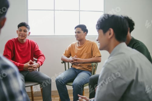 Preview: Portrait Of Young Diversity Group Focus Listening On Therapy Session
