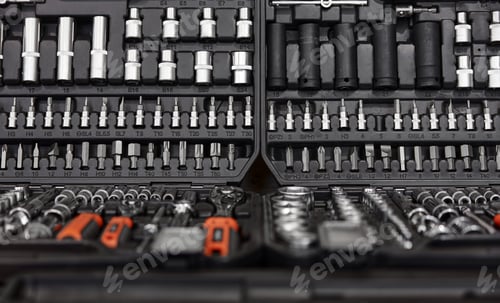 Preview: Closeup of tool box with kit of wrenches, screwdrivers and nuts for mechanic service