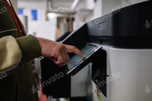 Preview: Crop man using printer in office