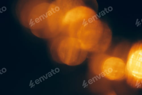 Preview: Abstract Gold bokeh sparkle on dark background