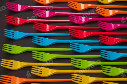 Preview: Many color plastic forks on a bright background