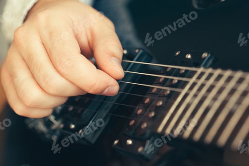 Preview: man playing electric guitar