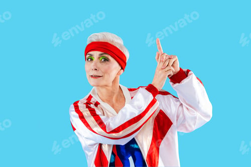 Preview: Happy and funny senior old woman on colorful background