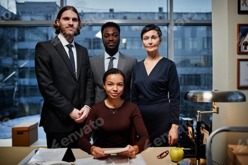 Preview: Successful team of business people posing professionally