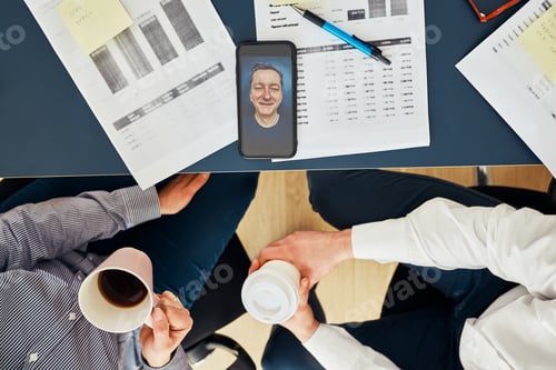 Preview: Business colleagues having video call discussing financial data working together in office. Teamwork