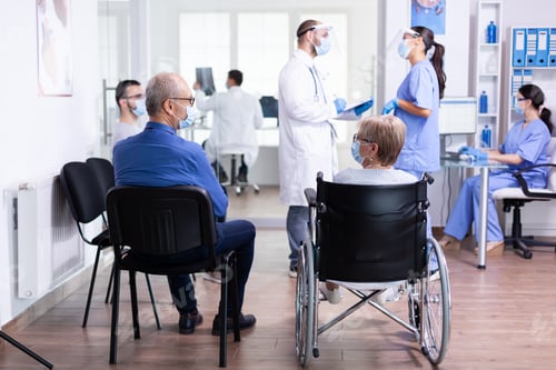 Preview: Discussing with nurse in hospital waiting area