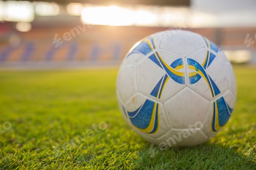 Preview: Old Soccer or Football in the sunset stadium Background