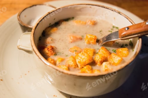 Preview: Cream mushroom soup with croutons in ceramic bowl