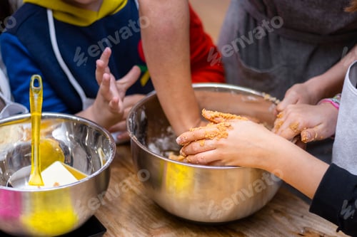 Preview: Christmas cookie workshops. Children kneading cookies.