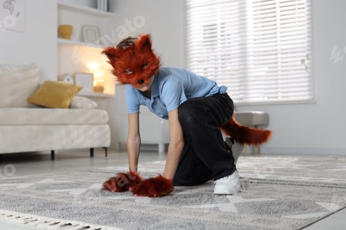 Preview: Quadrobics. Boy wearing fox mask, tail and gloves at home