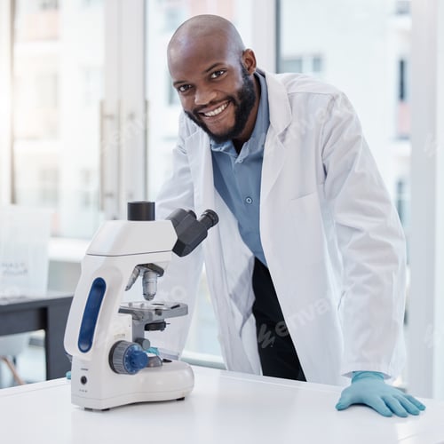 Preview: Shot of a young scientist using a microscope in a laboratory