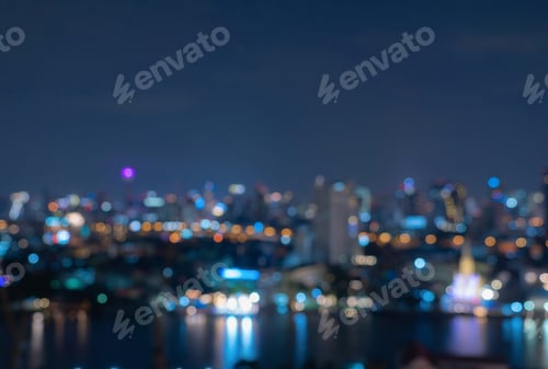 Preview: Bokeh of skyscraper buildings in city with lights, Blurry photo at night time. Cityscape background