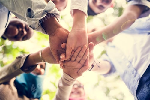 Preview: Group of diverse youth hands joined