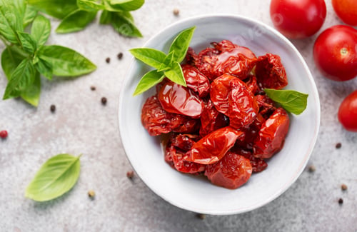 Preview: Bowl with sun dried tomatoes with fresh herbs and spices.