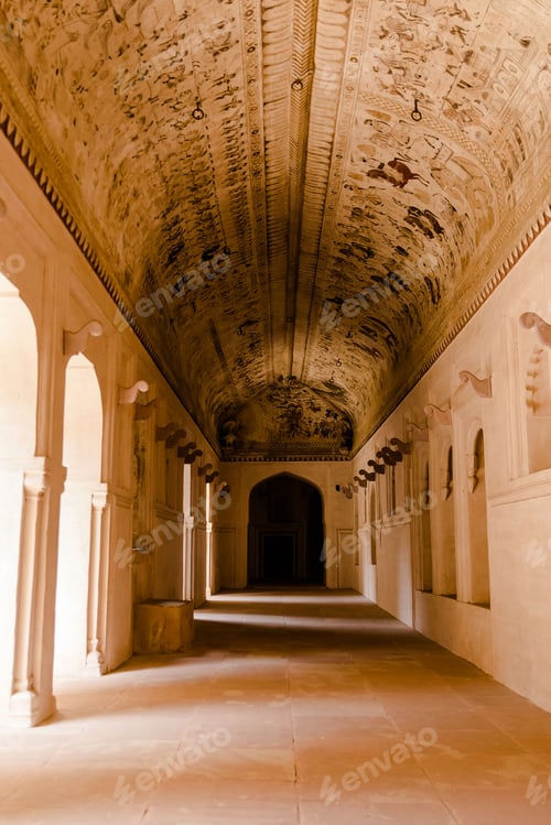 Preview: Interior of the long hallway with an archway entrance in Orchha Fort in India