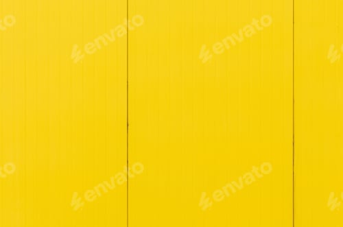 Preview: Bright yellow wooden board on wall, designer backdrop.