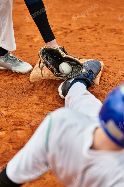 Preview: Two teenage boys engaged in a thrilling baseball match on the field